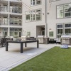 Game Lawn with cornhole boards and courtyard