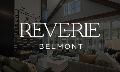 Reverie Belmont a logo and a lounge