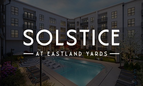 Love where you live a logo and a pool in a courtyard