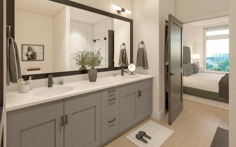 a bathroom with a large mirror and double sinks