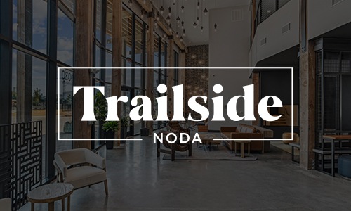 Trailside NoDa a logo and a lobby